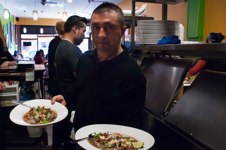 Alfonso Sotelo, chef and owner of 5 Rabanitos, showcases a selection of his restaurant’s savory dishes before sending them out to the floor (Elizabeth Vlahos - Feb. 26, 2017).