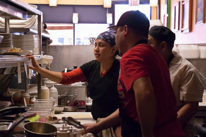 Miguel Ocorima and two other 5 Rabanitos employees verify an order that needs to be prepared during Sunday’s lunch rush hour (Elizabeth Vlahos - Feb. 26, 2017).