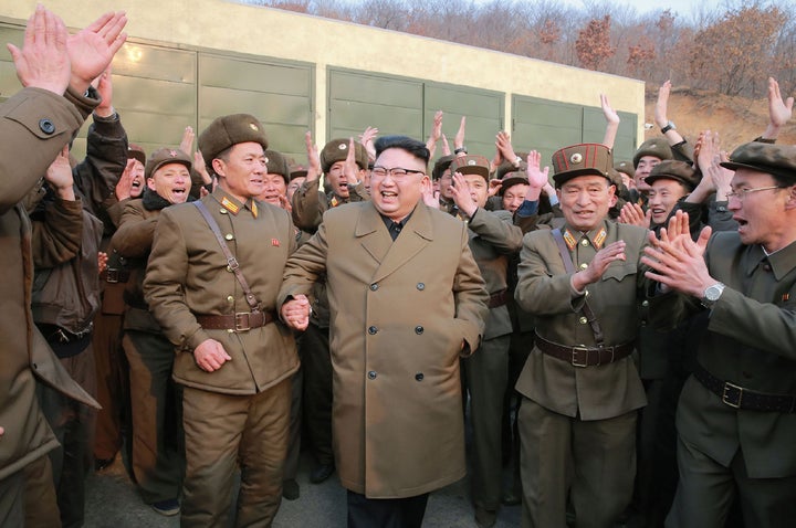 This undated picture shows North Korean leader Kim Jong-Un (centre) inspecting the ground jet test of newly developed high-thrust engine at a satellite facility