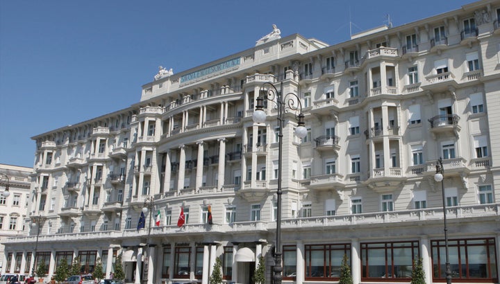 The grand sea-front facade of the Savoia Excelsior Palace, Trieste