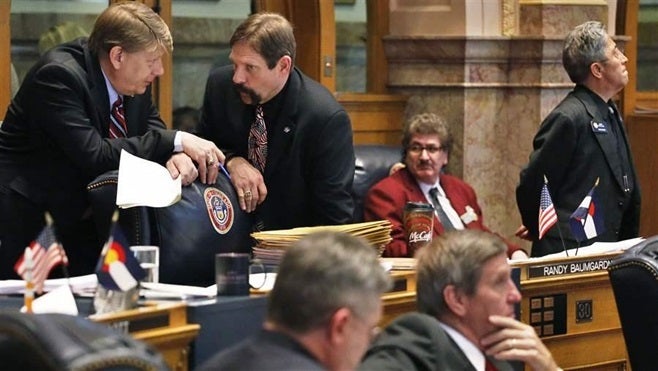 Former Republican Colorado state Sen. Mark Scheffel, left, now works for Advantage Capital Partners, which has been among the