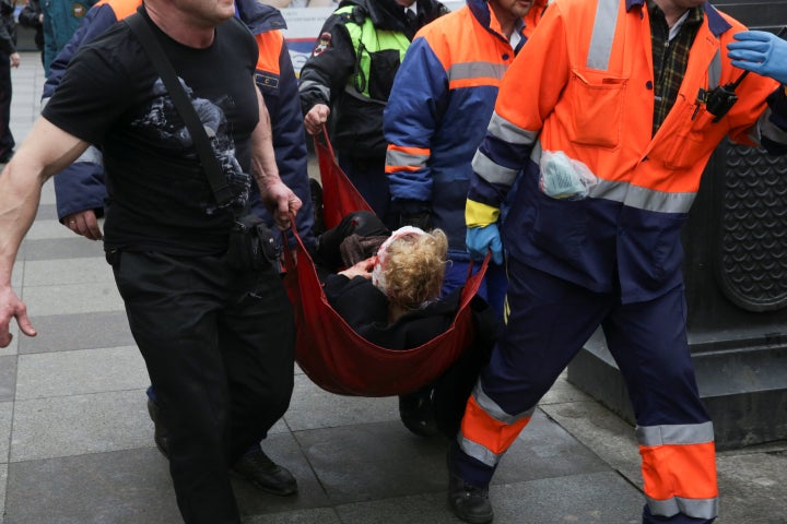 An injured person is helped by emergency services outside Sennaya Ploshchad station