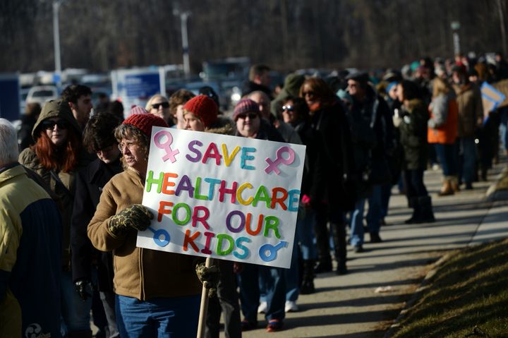 Karen Vermilya, of Onaway, Michigan, stands in line to enter the 'Our First Stand: Save Health Care' rally with Sen. Bernie Sanders, members of the Michigan congressional delegation and local elected officials at Macomb Community College on January 15, 2017 in Warren, Michigan.