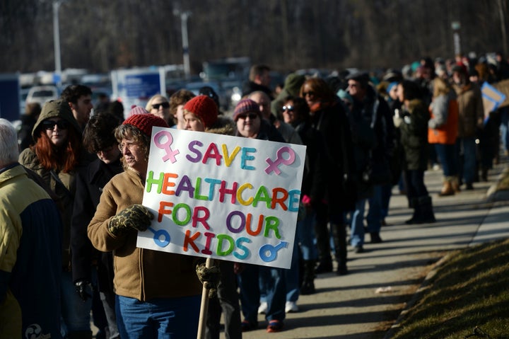 Karen Vermilya, of Onaway, Michigan, stands in line to enter the 'Our First Stand: Save Health Care' rally with Sen. Bernie S