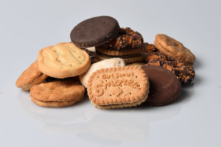A cookie pile made up of beloved Girl Scout cookies.