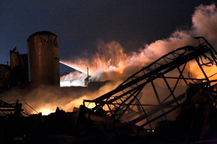 Smoke rises as water is sprayed at the burning remains of a fertilizer plant after an explosion at the plant in the town of West, near Waco, Texas, early April 18, 2013. The Obama administration issued safety rules for chemical plants in the wake of the deadly explosion, and the GOP is now aiming to repeal them.