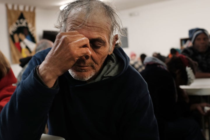 A homeless man prays at the Seashore Mission, which offers services to the homeless and those in need, on Jan. 3, 2016, in Biloxi, Mississippi.