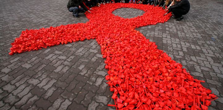 Activists form a red ribbon, the symbol of the worldwide campaign against AIDS in Russia, 2010. 