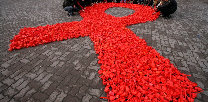 Activists form a red ribbon, the symbol of the worldwide campaign against AIDS in Russia, 2010.