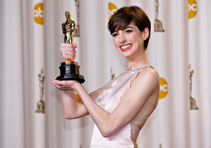 Anne Hathaway holds her Oscar for winning Best Supporting Actress for her role in "Les Miserables."