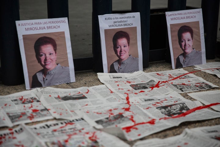 Portraits of slain journalist Miroslav Breach are displayed at a protest in Mexico City on March 25. She became the third Mexican journalist killed in March.