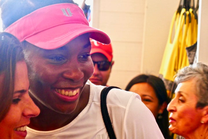 Venus Williams taking a selfie with a fan at the Miami Open.