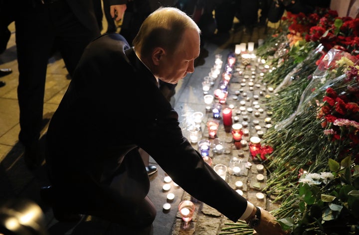 Russia's President Vladimir Putin lays flowers in memory of the St Petersburg Metro explosion victims at Tekhnologichesky Institut station