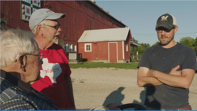 Three generations of Lauderdales discuss their day on the farm. From left to right: George Lauderdale, Gene Lauderdale, Dan L