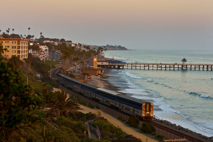 The Pacific Surfliner rolls through San Clemente at dusk. 