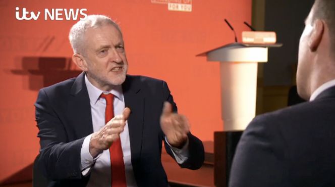 Jeremy Corbyn reacts to reporter Paul Brand's question.
