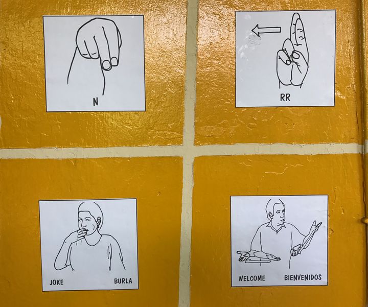 The cafe's walls are covered with words and phrases in Spanish and English ― from “Thank you” to “Welcome” ― with illustrations in Nicaraguan Sign Language.