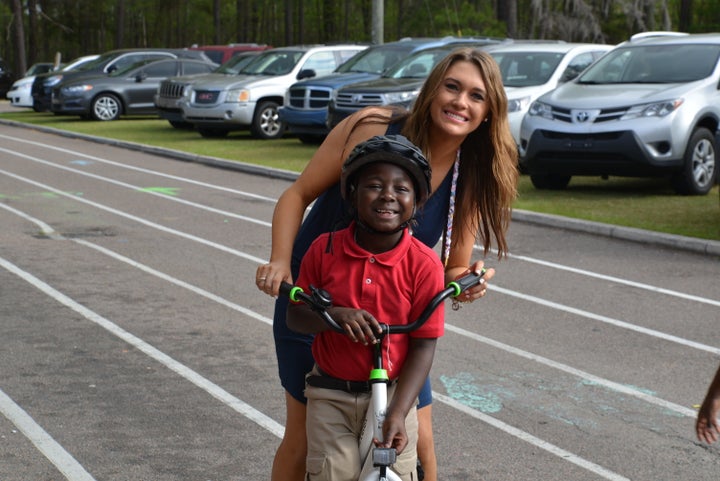 Katie Blomquist with one of her students who has just received a new bike.