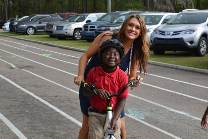 Katie Blomquist with one of her students who has just received a new bike. 