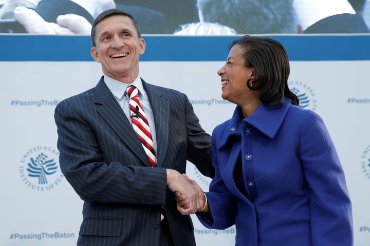 White House National Security Adviser Susan Rice (R) and former Defense Intelligence Agency Director retired Army Lt. Gen. Michael Flynn, incoming White House national security adviser, shake hands at the U.S. Institute of Peace "2017 Passing the Baton" conference in Washington, U.S., January 10, 2017. Flynn subsequently resigned that post after his contacts with Russian officials were revealed despite his claims that there had not been any.