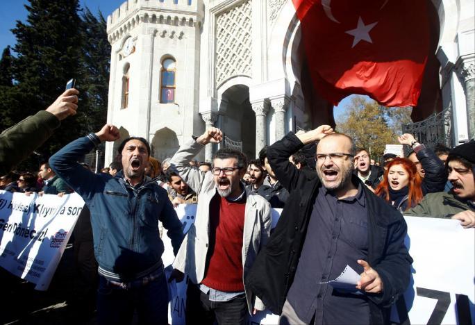 Demonstrators protest the purge of thousands of education staff in front of Istanbul University at Beyazit square in Istanbul, Turkey.