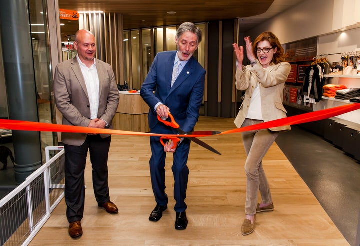 Gregory Castle cuts the ribbon to officially open the new adoption center.