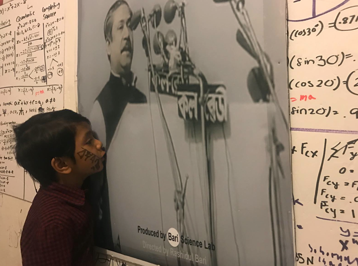 <p>Isaac gives a kiss to the image of Bangabandu, the Father of Bangladesh, after listening his 7th March Speech. </p>