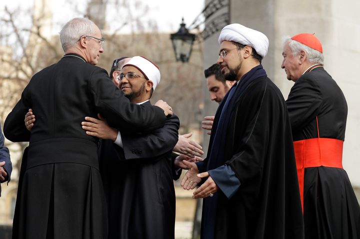 The Archbishop of Canterbury, Justin Welby, left, embraces Sheikh Ezzat Khalifa as Sheikh Mohammad al Hilli and Cardinal Vincent Nichols, Archbishop of Westminster, right, approach during a gathering of faith leaders on March 24