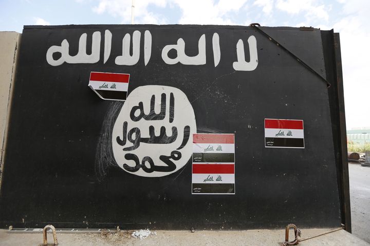 A wall painted with the black flag commonly used by Islamic State militants, near former Iraqi president Saddam Hussein's palace in Tikrit.