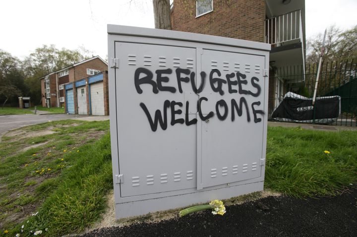 Police and community leaders were to visit the crime scene on Wednesday; graffiti saying 'refugees welcome' nearby is pictured above