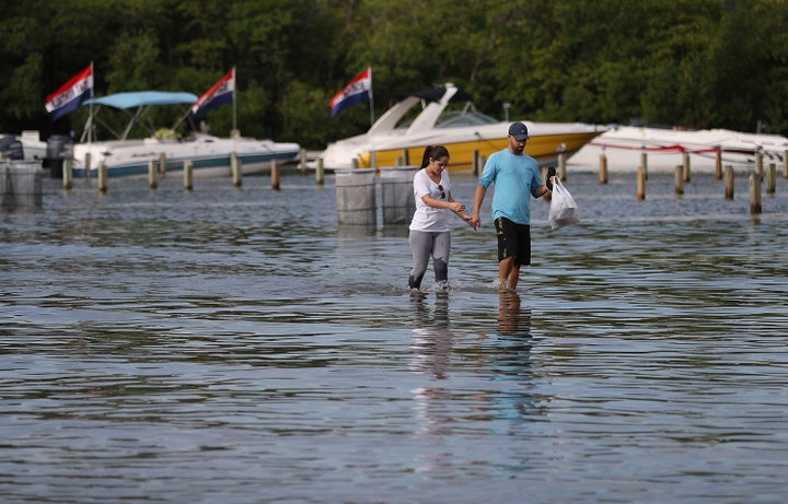 A flooded parking lot in North Miami, Florida, last November. The flood was caused by the combination of the lunar orbit, which causes seasonal high tides, also known as a king tide, and rising sea levels due to climate change.