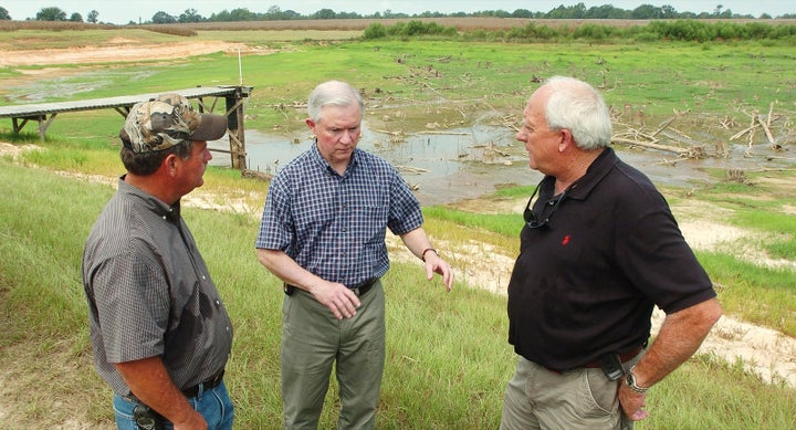 U. S. Senator Jeff Sessions, center, speaks with Alabama farmers on November 29, 2007.