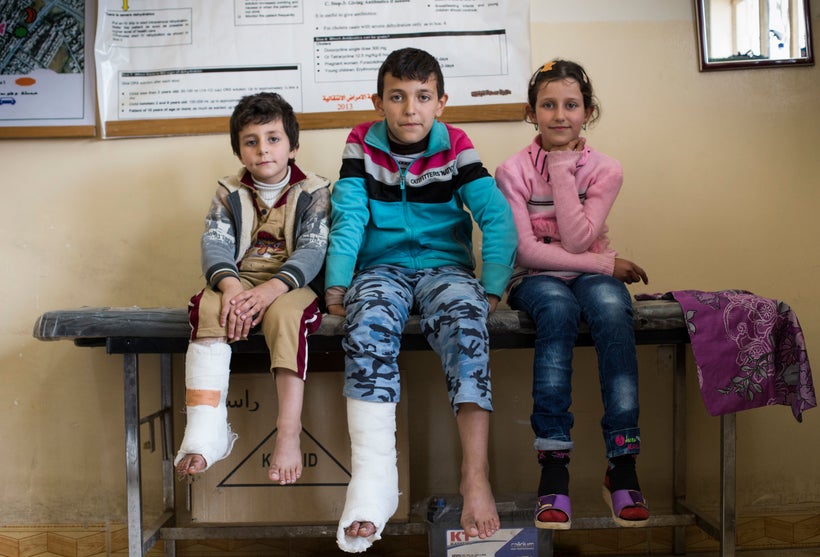From left: Ahmed Wissan Thanoon, 6, Mohmed Wissan Thanoon, 11, and Zahra Wissan Thanoon, 9, at the primary heatlh care clinic