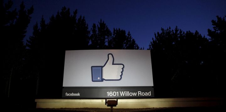 The sun rises behind the entrance sign to Facebook headquarters in 2012 in this file photo. Facebook announced a suite of new tools Wednesday to combat revenge porn on the site.