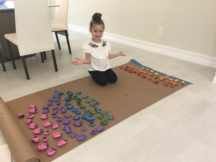 Ayel's mom said the 6-year-old has painted "hundreds of rocks" for her project.