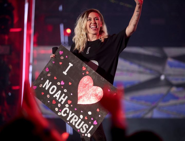 Miley Cyrus cheering Noah Cyrus on during her performance at the 2017 iHeartRadio Music Awards.