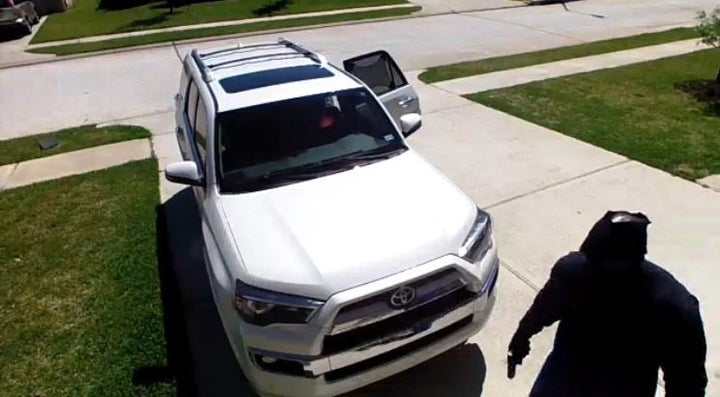 A screenshot of the video that captured the alleged abduction. The suspect appears to be holding a gun.