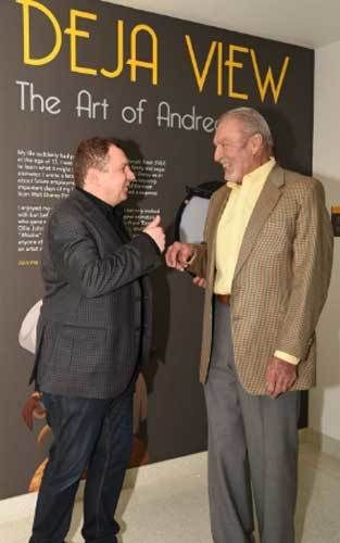 <p>Andreas Dejas shares a laugh with Ron Miller at the opening reception for “Deja View: The Art of Andreas Deja.”</p>