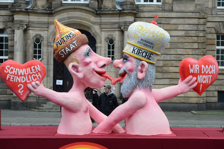 A float featuring Putin kissing Russian Orthodox Church Patriarch Kirill with texts reading 'Anti Gay ?' and 'Not us!' makes its way through the streets of Dusseldorf in 2014