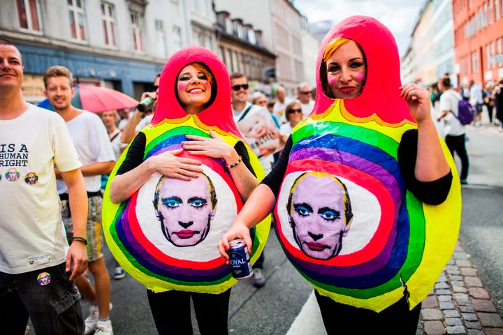 Two Copenhagen Gay Pride participants wear matryoshka doll costumes featuring Putin's image in Copenhagen, 2013 