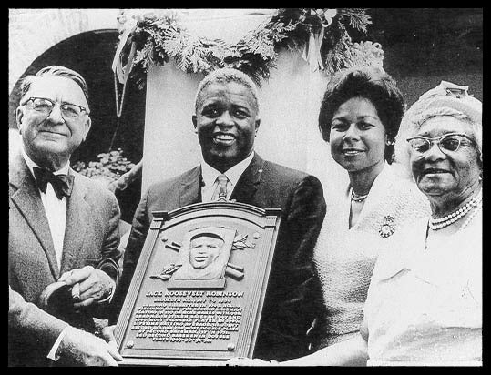 Left to right: Branch Rickey, Jackie, Rachel Robinson, Mallie Robinson