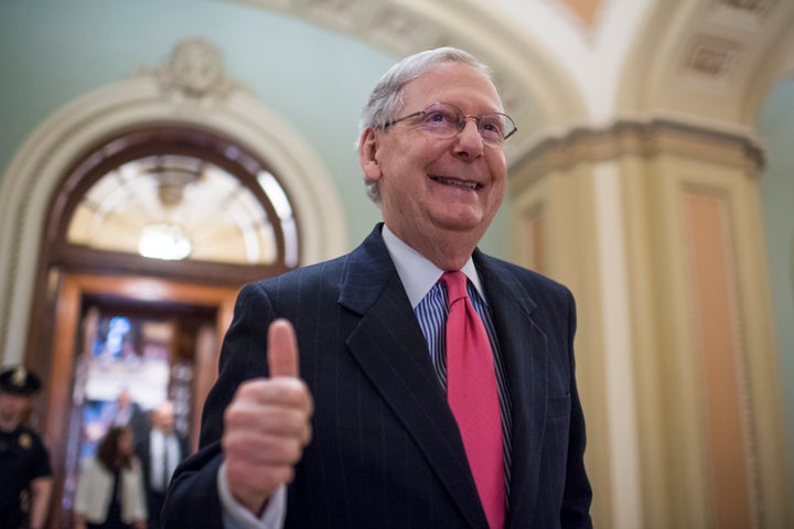 Mitch McConnell gives a thumbs up after changing the Senate rules to force through Supreme Court nominee Neil Gorsuch's confirmation on a party-line vote.