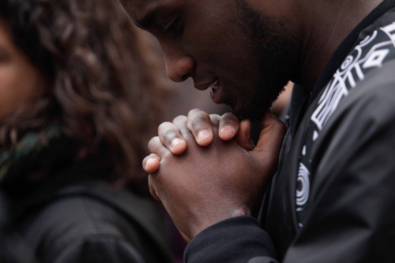 A protestor prays during a rally for black lives in New York City.