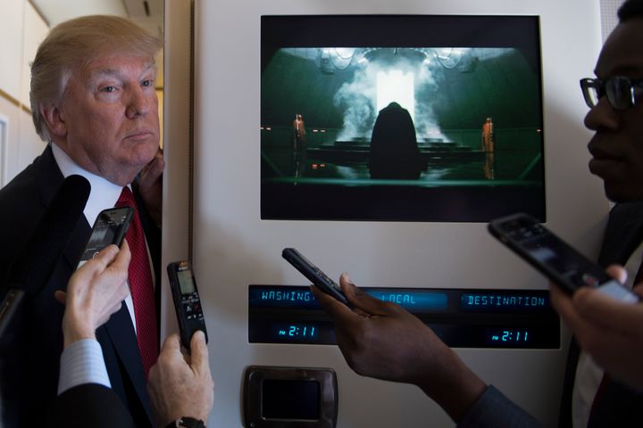 US President Donald Trump speaks to the press on Air Force One on April 6, 2017.
