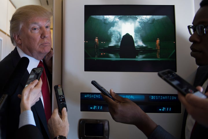 US President Donald Trump speaks to the press on Air Force One on April 6, 2017.