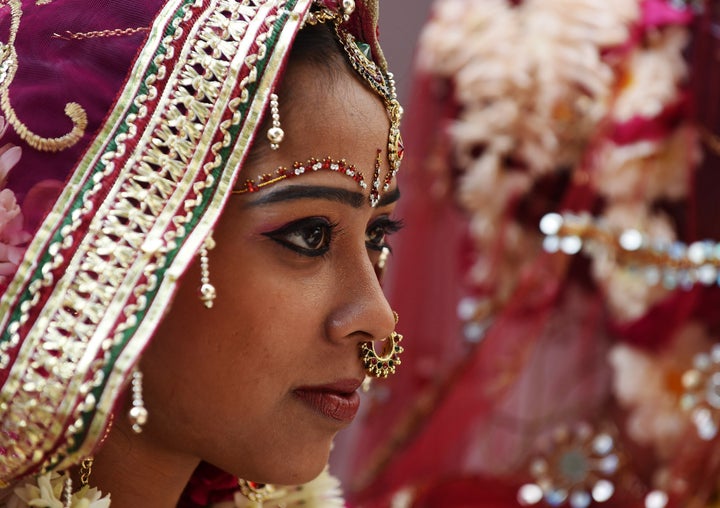 Brides in India often wear a maang tikka upon their foreheads. It symbolizes the bride's third eye.