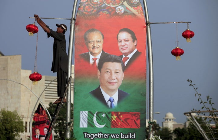 A 2015 poster in Islamabad shows Pakistan’s President Mamnoon Hussain (L), China’s President Xi Jinping © and Pakistan’s Prim