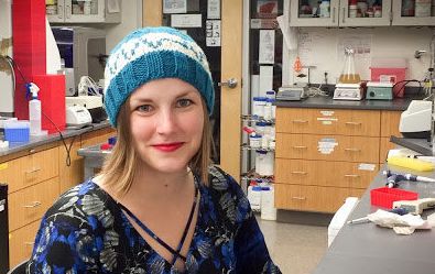Microbiologist Heidi Arjes shows off a resistor hat in her Stanford University lab.