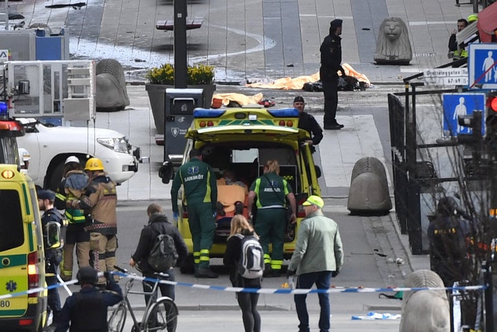 Paramedics attend to one of those injured by the truck