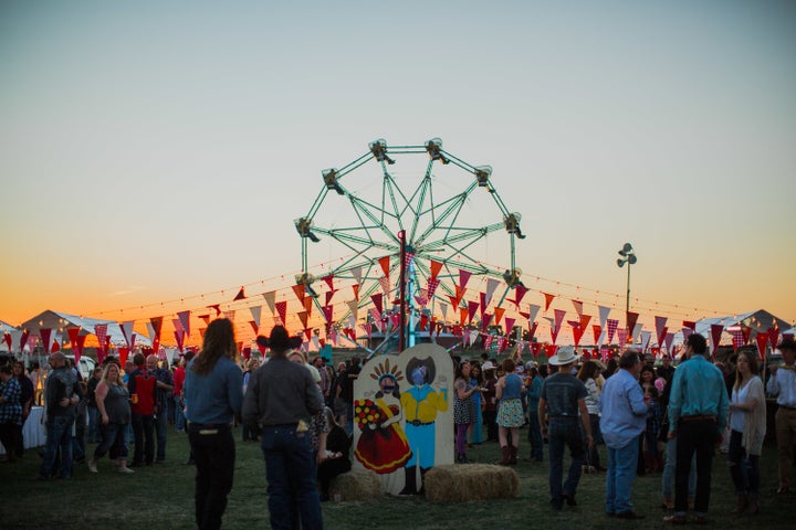 Sun sets over the Ferris wheel. 